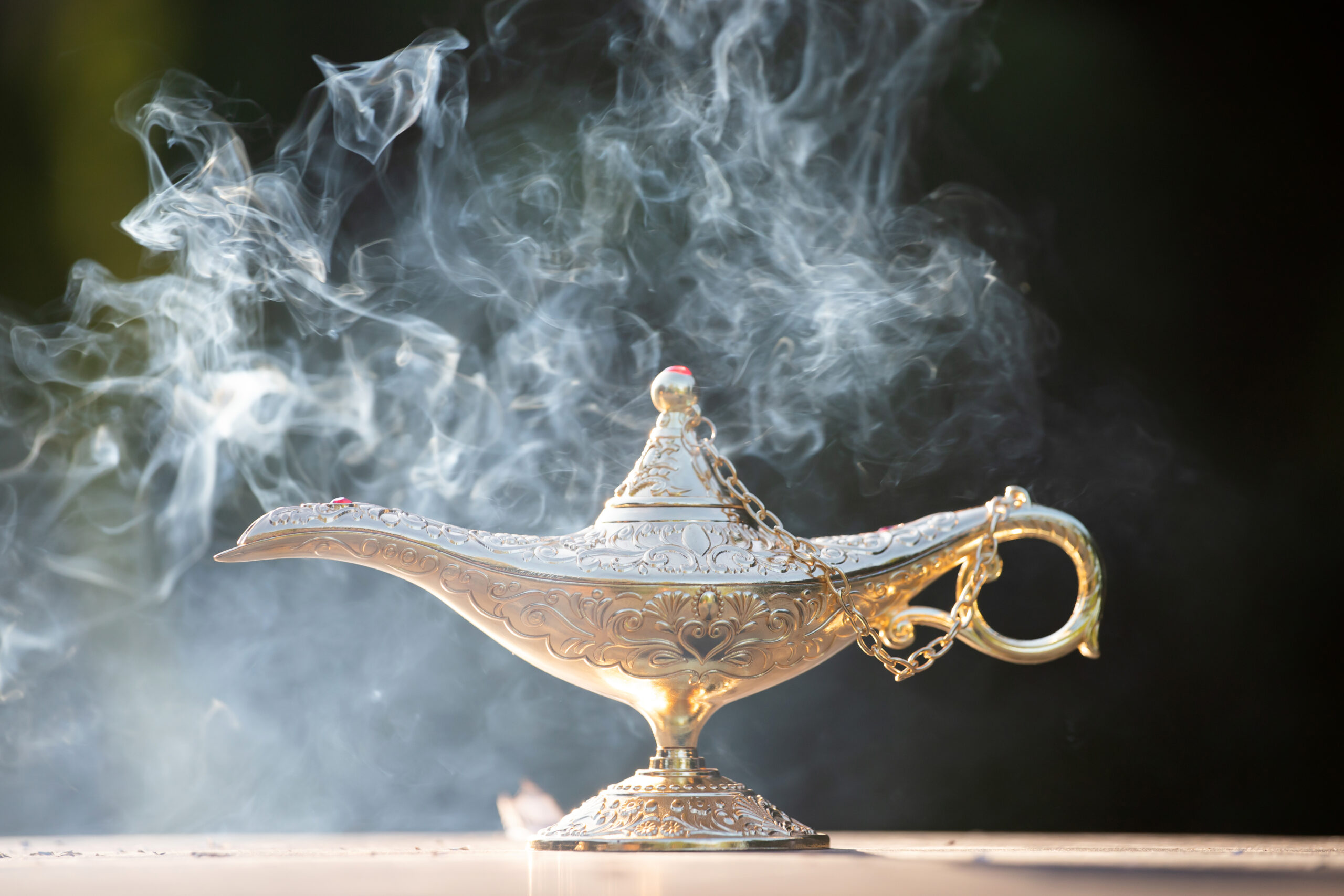 Magic lamp from the story of Aladdin in smoke. Concept for wishing, luck and magic